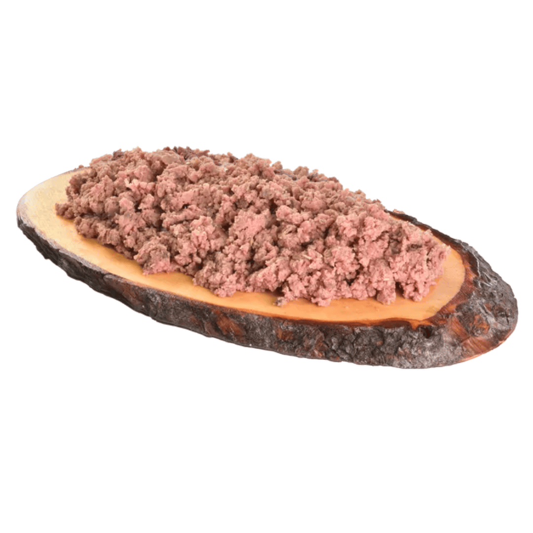The Carnilove Pheasant with Raspberry leaves wet dog food served on a wooden dish has a Mince like consistency.