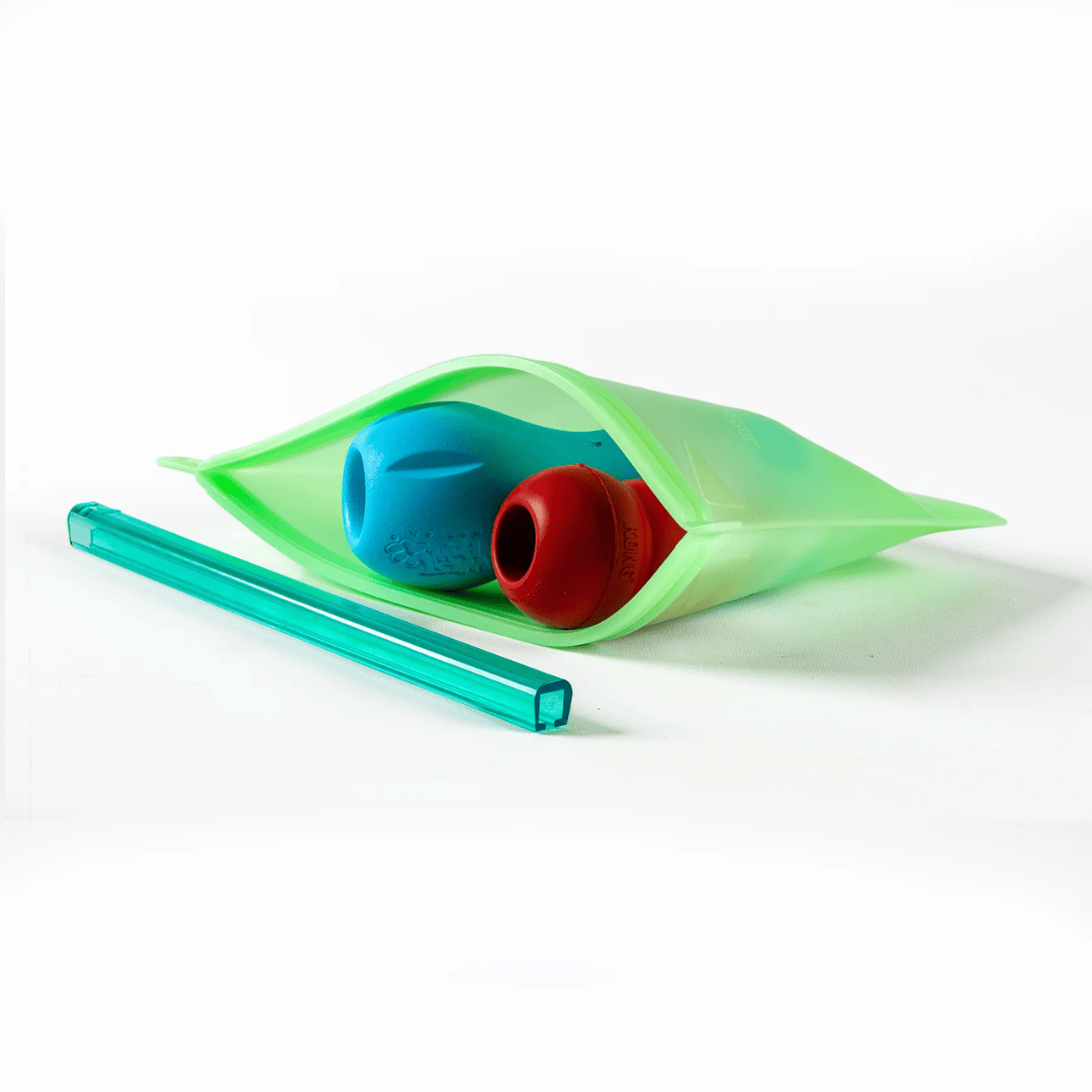 Enrichment dog toys inside a green No Fuss Fill Prep and GO bag.