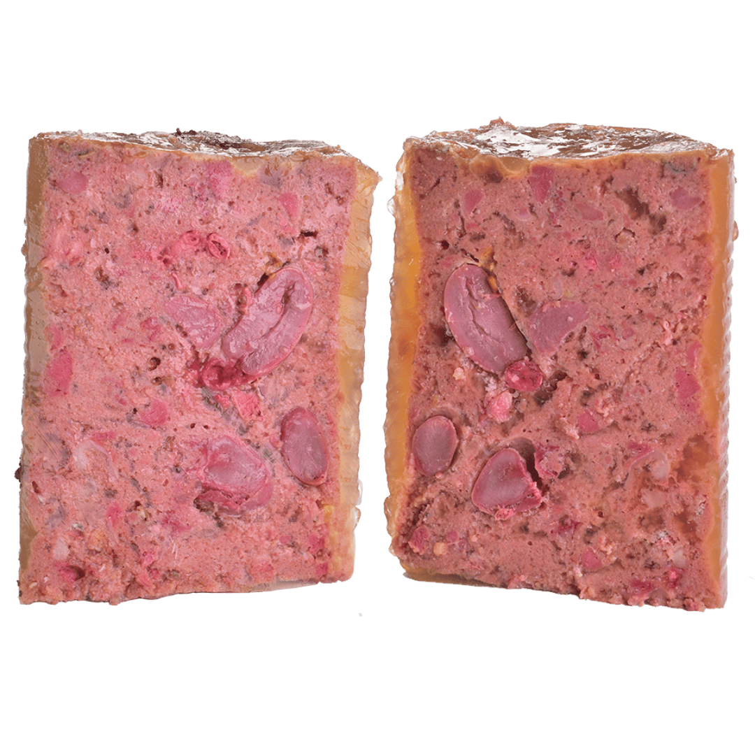 The Carnilove Salmon & turkey wet dog food for puppies removed from the tin and cut in half to show it's profile. You can see many different textures.