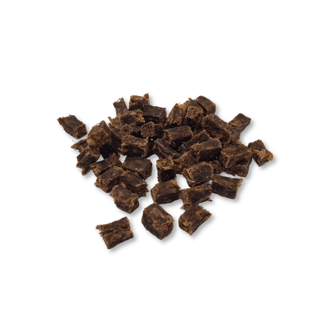 Pile of beef cubes on a white background