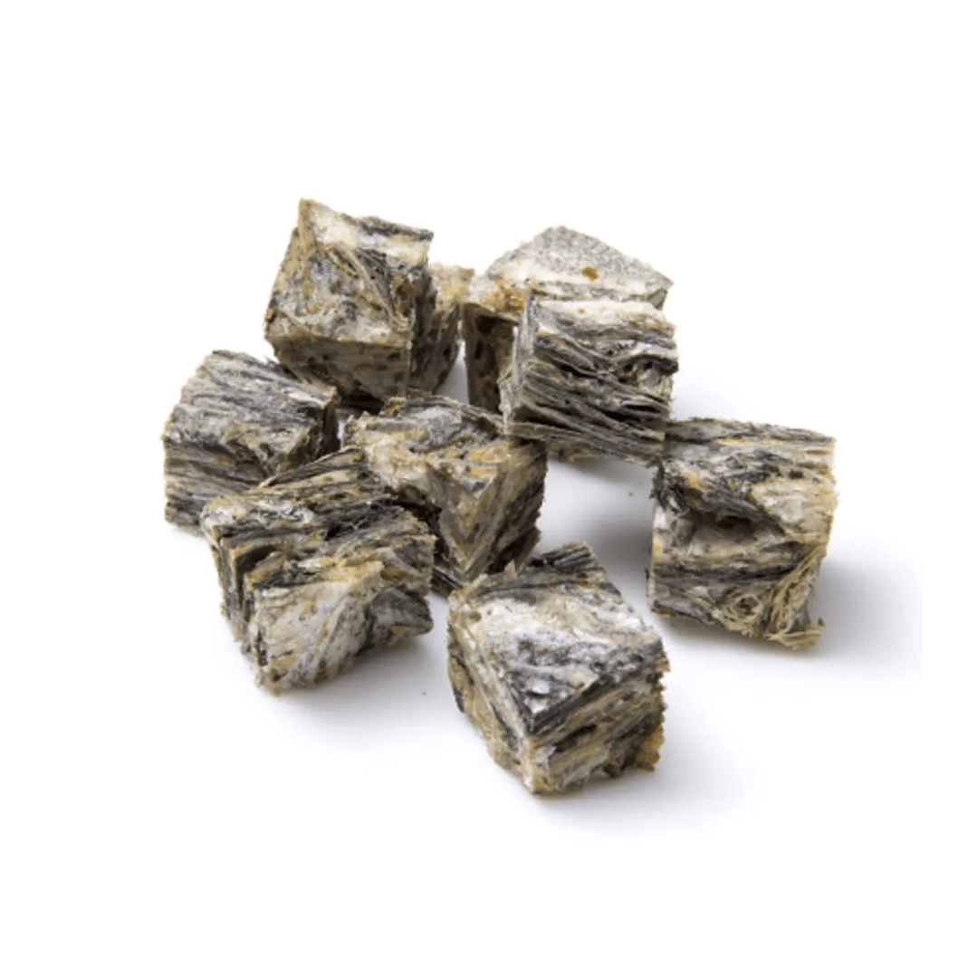 pile of of dried cod skin blocks on a white background