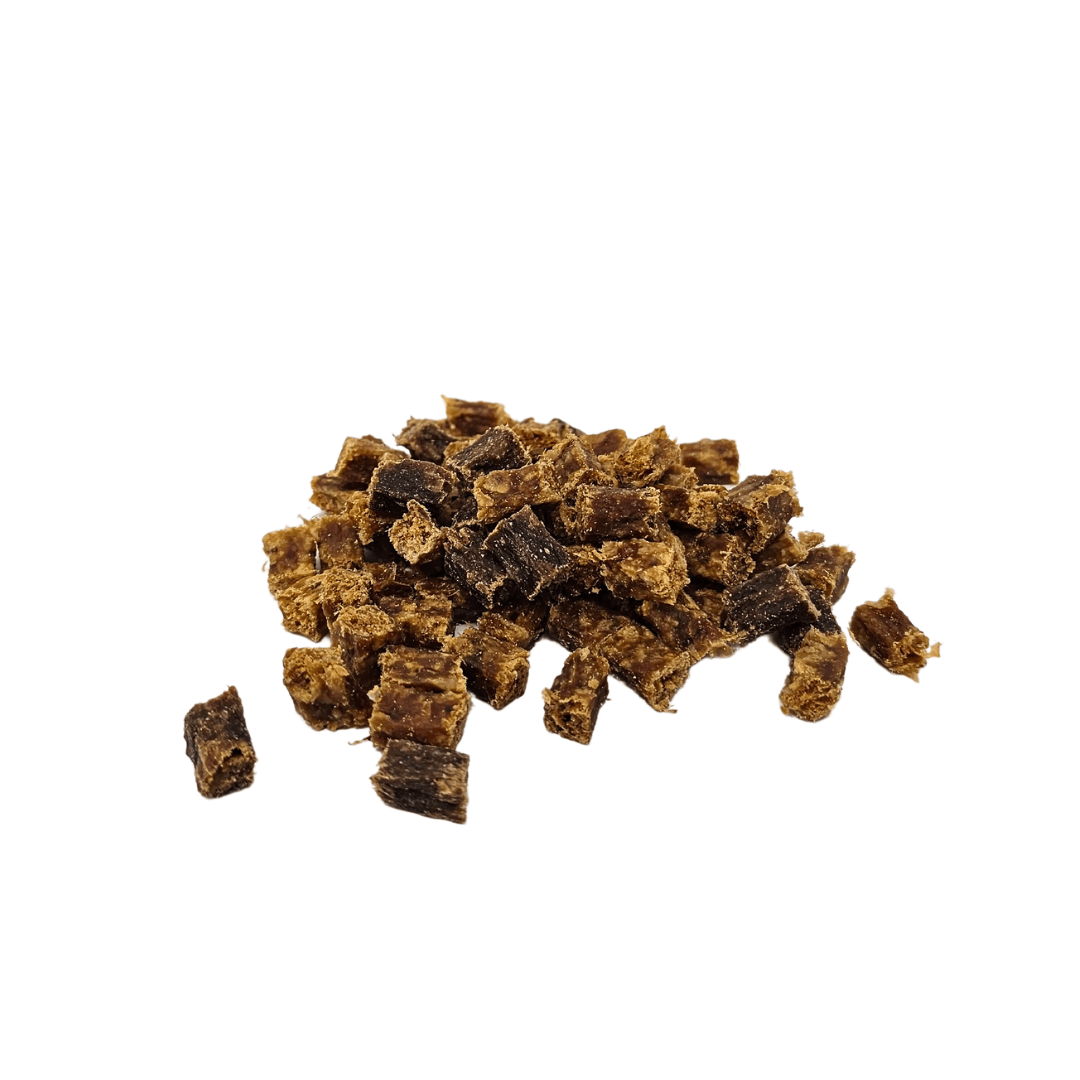 Pile of dried duck cubes on a white background