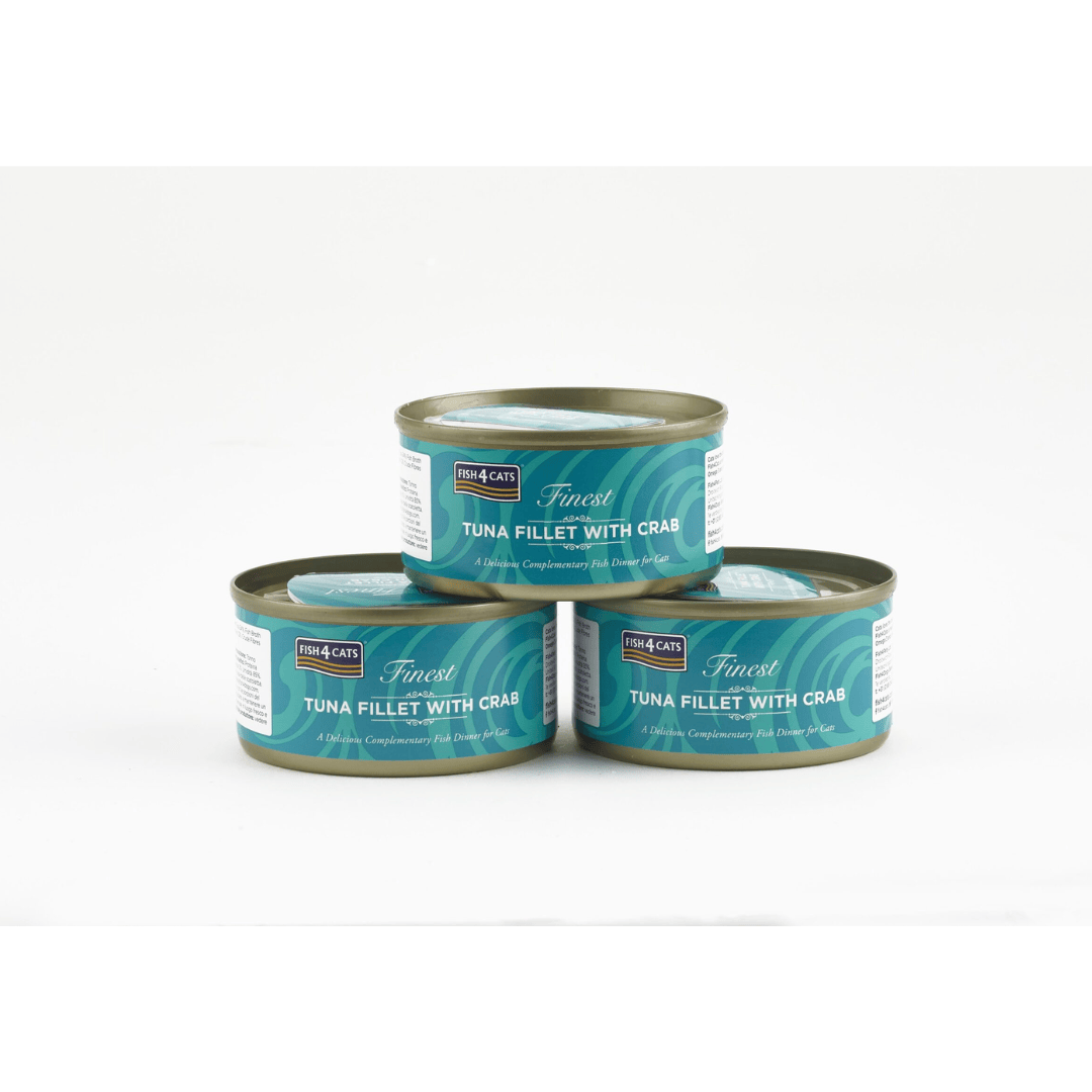 Three cans of tuna fillet with crab on a white background