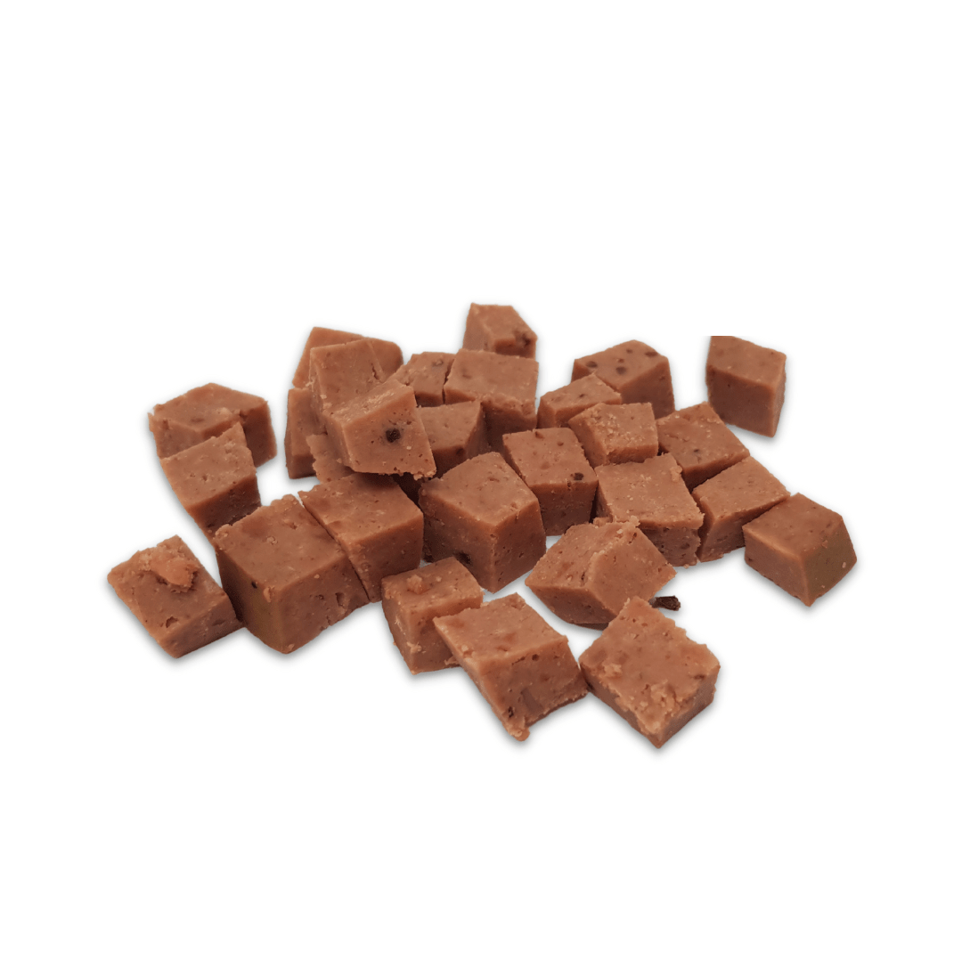 Chopped up beef paté on a white background