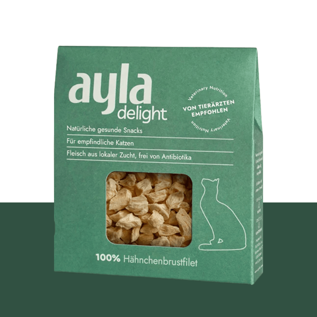 Green packaging of ayla delight cat snacks with visible text and a window showing the product.