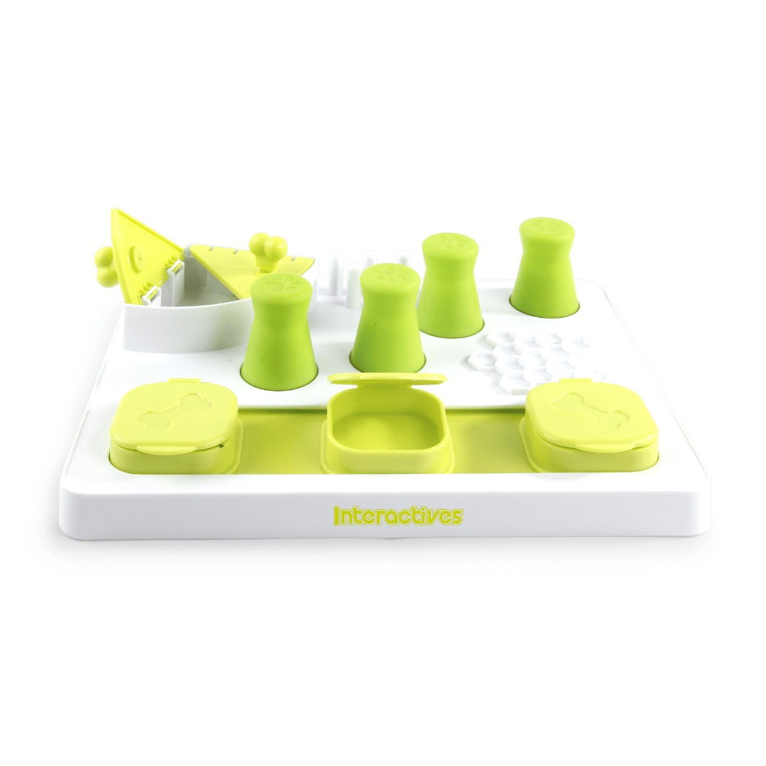 Dog interactive slow feeding puzzle with green and white components on a white background