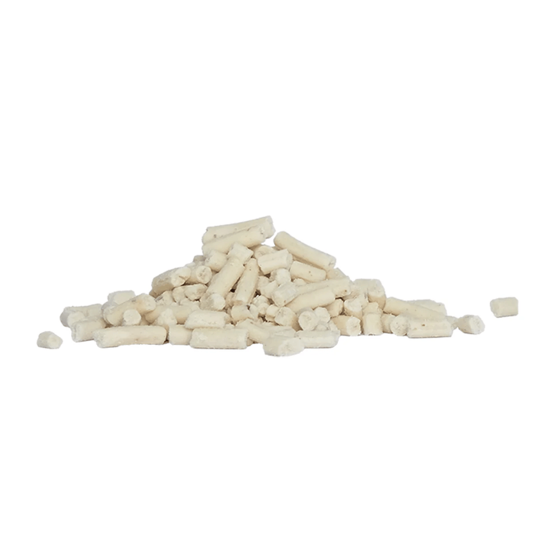 Pile of white cylindrical mealworm suet pellets on a white background