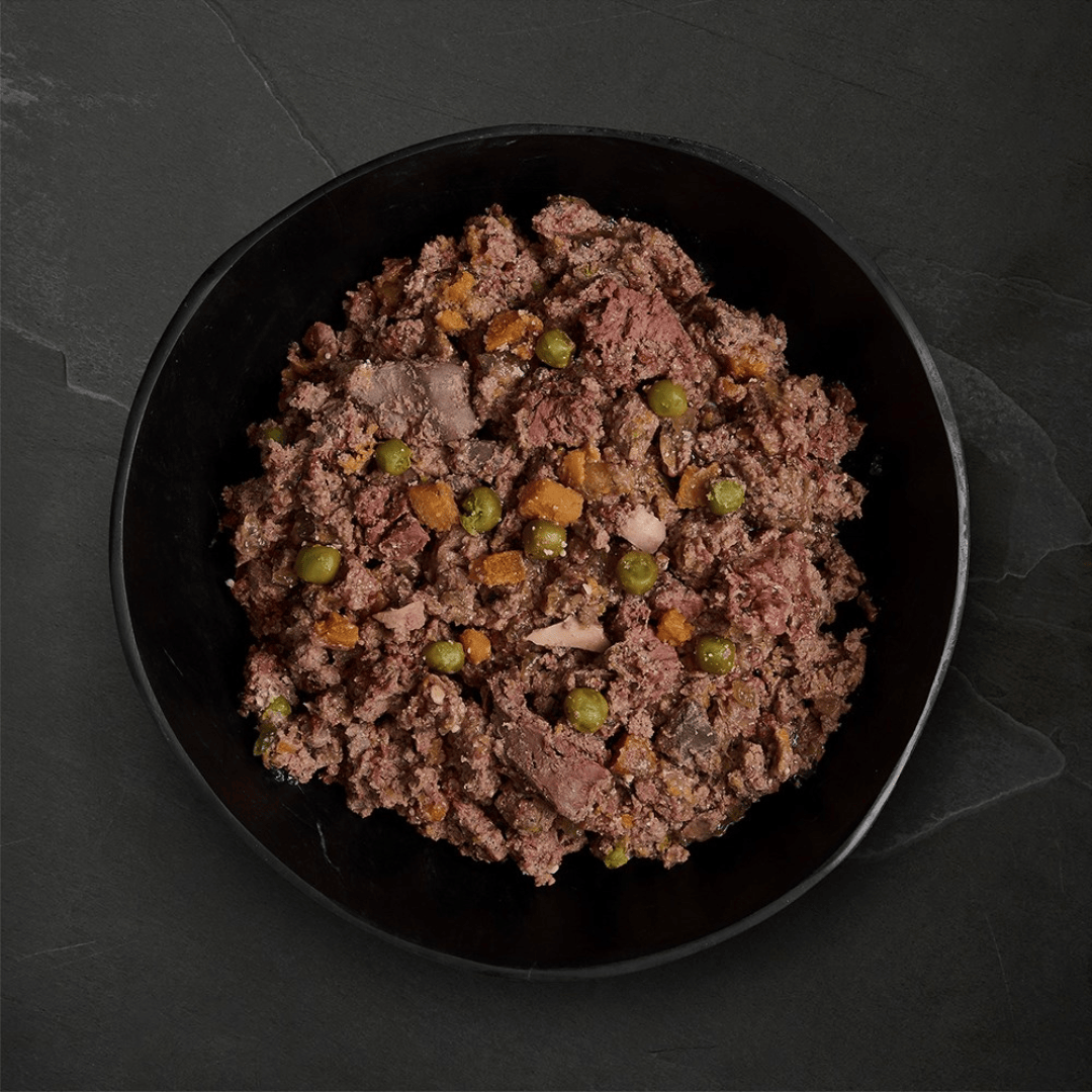 Canagan Shepherd's Pie Wet Dog Food 400g served in a bowl. A chunky mince like texture with veg.