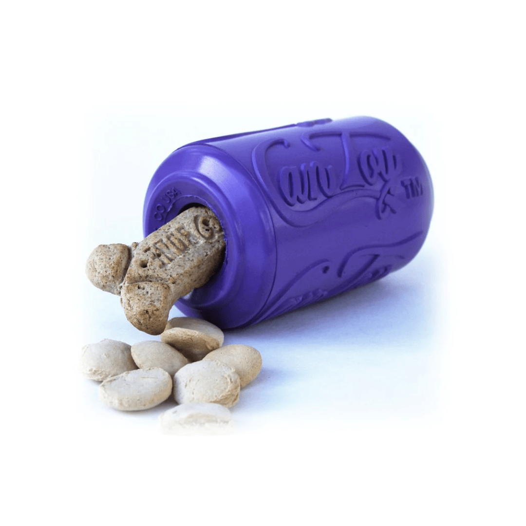 Sodapup Soda Can dog toy in large purple being used as a treat dispenser. There is a bone shaped dog biscuit sticking out and some smaller treats beside.