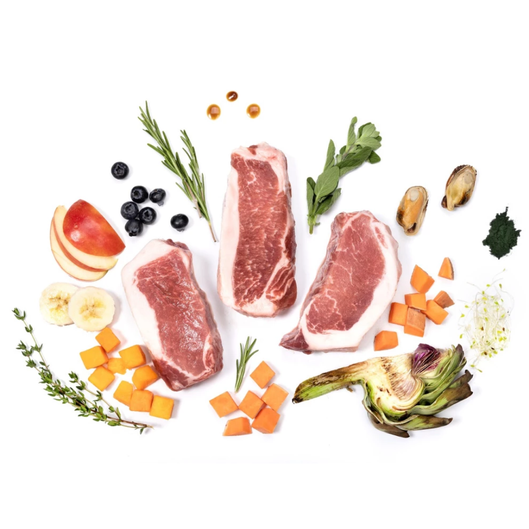 Raw ingredients of Ydolo pork semi moist dog food including artichoke, apples and spirulina.