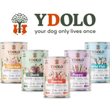 An image by YDOLO showing their new wet food range. The YDOLO logo  is above the tins.
The tins include chicken, duck, iberico, puppy and wild fish.