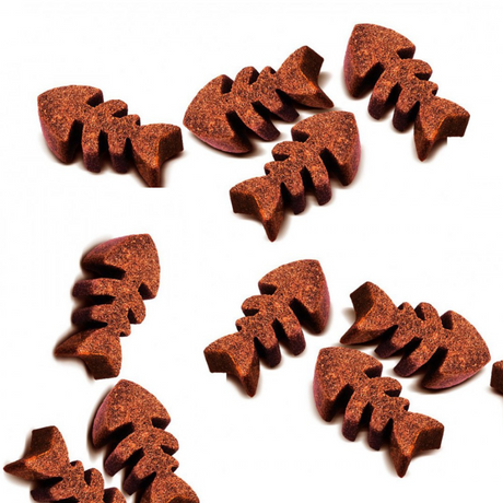 The Carnilove Trout with Dill Soft snacks spread out on a white background. They are shaped as fish.