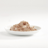 The  Fish 4 Cats Tuna & Salmon cat food served on a plate with a soft, fish consistency