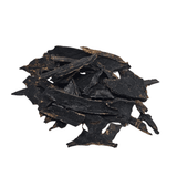 Stack of dried beef liver pieces on a white background