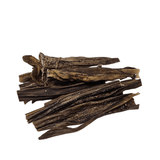 Goat chews on a white background
