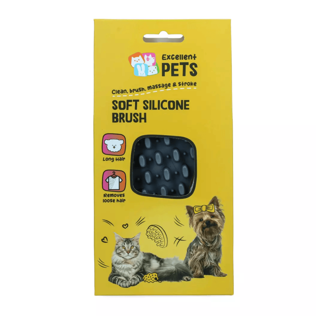 Yellow retail packaging for an Excellent Pets soft silicone brush, showing a black textured brush window and illustrations of a cat and dog on a white background.