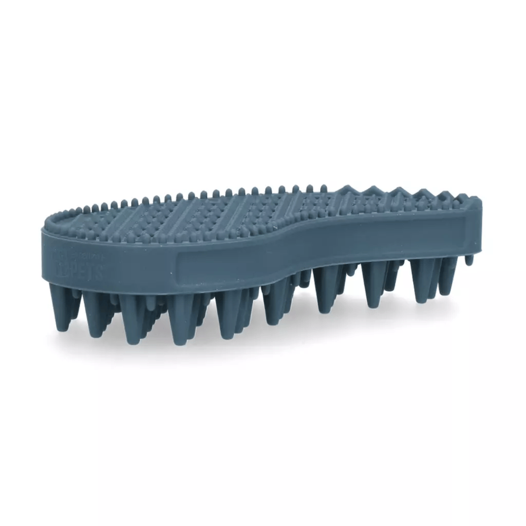 A dark slate blue pet grooming brush with dense bristles and a textured nubby top surface, shown on a clean white background.