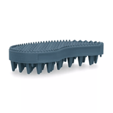A dark slate blue pet grooming brush with dense bristles and a textured nubby top surface, shown on a clean white background.