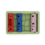 The puzzle roller shown from birds eye view. The three cylindrical 'rollers' are in it and the red one has a hatch open for easy access to fill the toy.