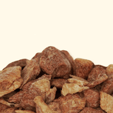 Close-up of dried duck breast pieces on a beige background