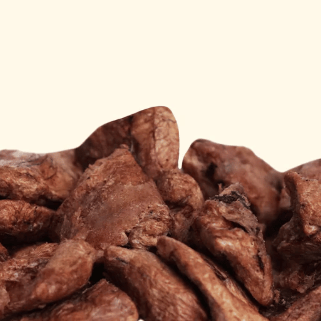 Close-up of dried chicken hearts on a beige background