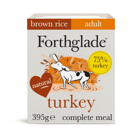 A package of Forthglade adult brown rice turkey complete meal, 395g. The packaging features a white background with orange and brown accents, a cartoon illustration of a dog, and a yellow circle badge indicating 75% turkey.