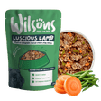 Wilson's Luscious Lamb dog food package with a bowl of dog food, carrots, and green beans on a white background