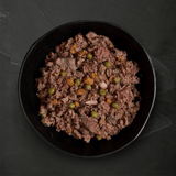 Canagan Shepherd's Pie Wet Dog Food 400g served in a bowl. A chunky mince like texture with veg.