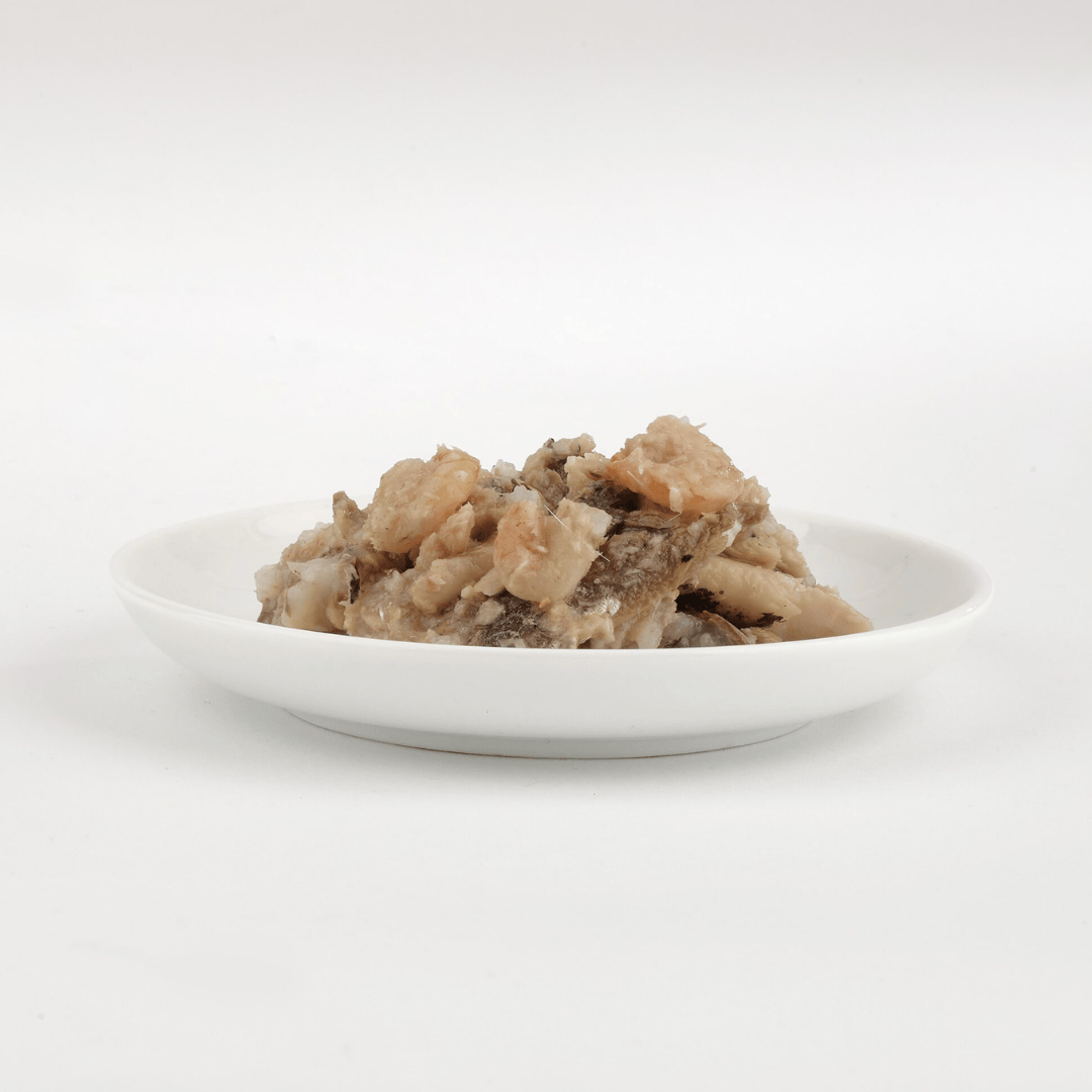 The  Fish 4 Cats Sardine & Shrimp cat food served on a plate with a soft, fish consistency