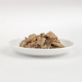 The  Fish 4 Cats Sardine & Shrimp cat food served on a plate with a soft, fish consistency