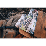 The Carnilove Dck with Timothy Grass pouch sticking out of a rugsack. 